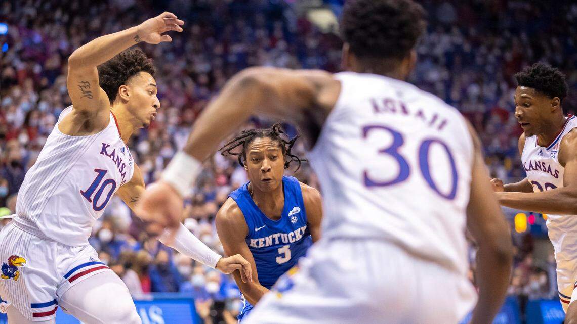 Kentucky’s TyTy Washington looks for room to operate amid a trio of Kansas defenders during the Wildcats’ 80-62 win in Lawrence in January. “It humbled us to know, in order for us to compete at the highest level, which they were that day, we’ve got to get a lot better in a lot of areas,” Jayhawks Coach Bill Self said this week.