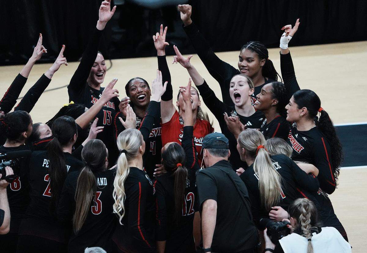 Louisville celebrates its 3-1 win over Penn State in the NCAA semifinals at the KFC Yum! Center on Thursday night. The Cardinals will seek their first national title when they face Penn State on Sunday in Louisville.