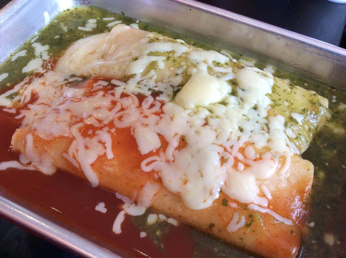 Cheese enchiladas in a red sauce and a green sauce at El Cid. The green sauce is delicious.