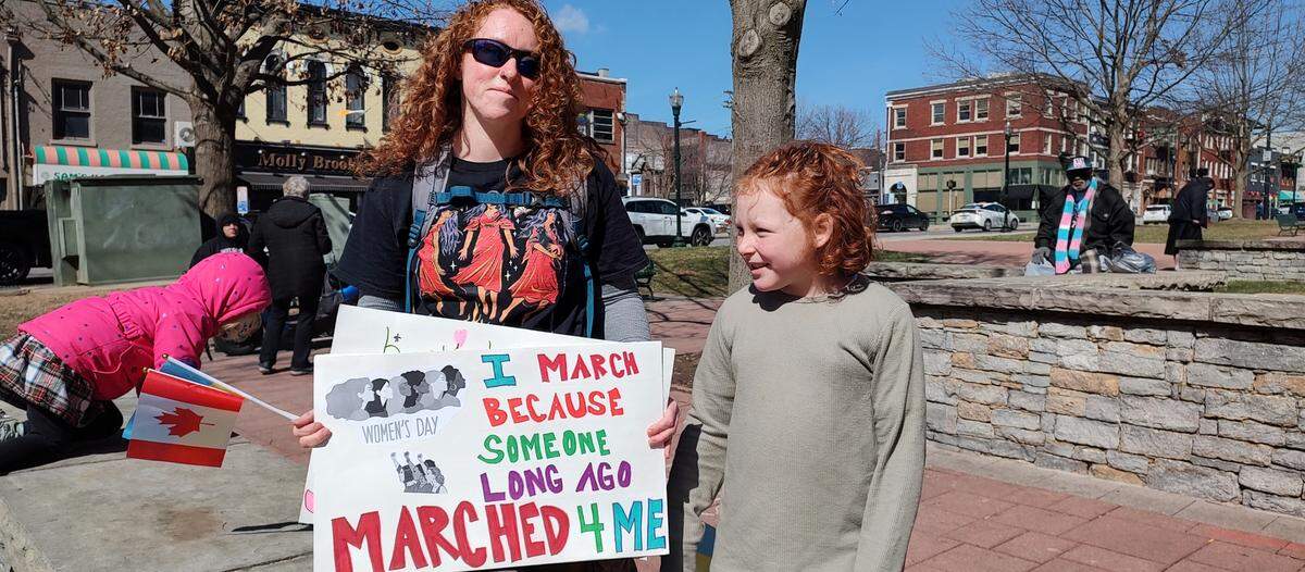 Shelby Abrams and her daughter Riley Rector were among the demonstrators gathered in the courthouse plaza in Lexington, Ky., on International Women’s Day Saturday.