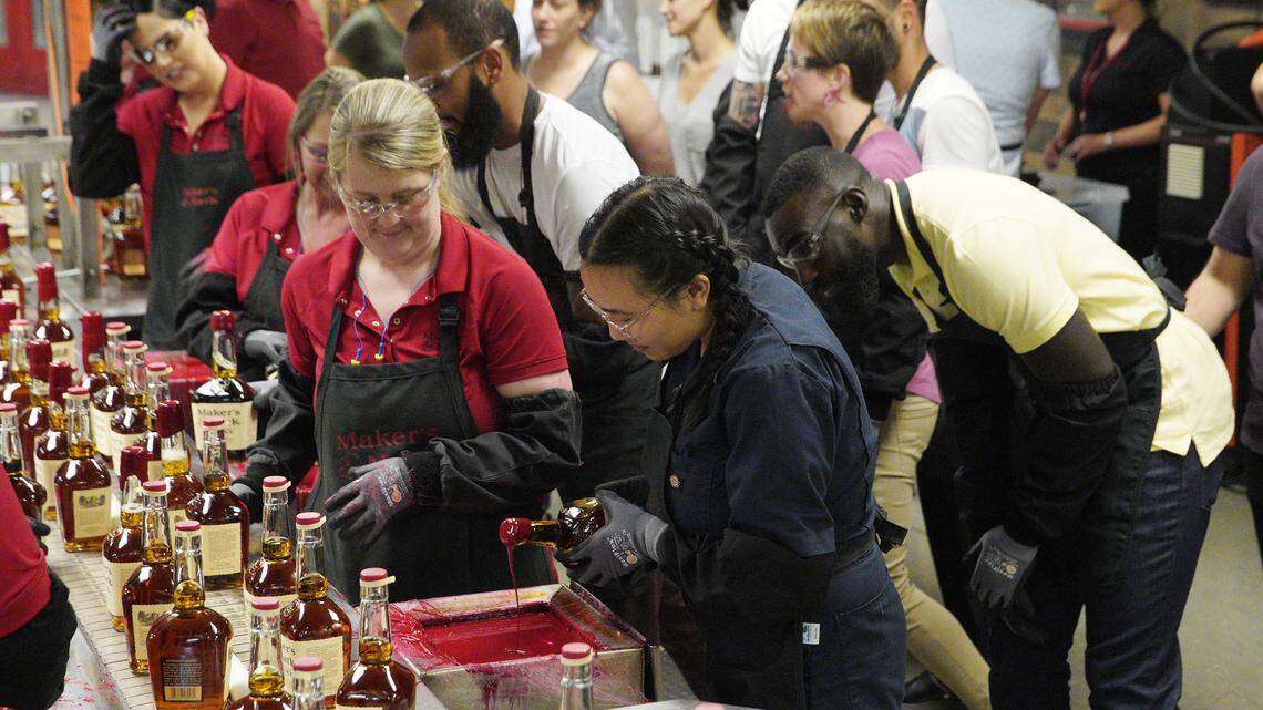 “Top Chef” contestants Nini Nguyen and Eric Adjepong take a dip into bourbon at Maker’s Mark Distillery in Loretto for the elimination challenge of the second episode of the Kentucky season, “Bourbon, Barrels and Burgoo.”