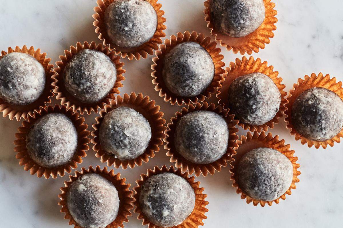 During preparation of these fudgy bourbon balls, you can either store them in an airtight container if you want them moist, or uncovered if want them to develop a crunchy sugar crust on the outside.