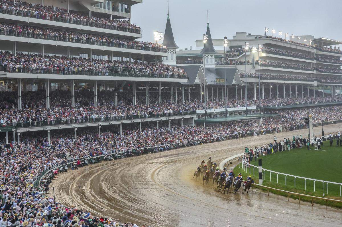 The field rounds the first turn during the 151st running of the Kentucky Derby at Churchill Downs in Louisville on Saturday.