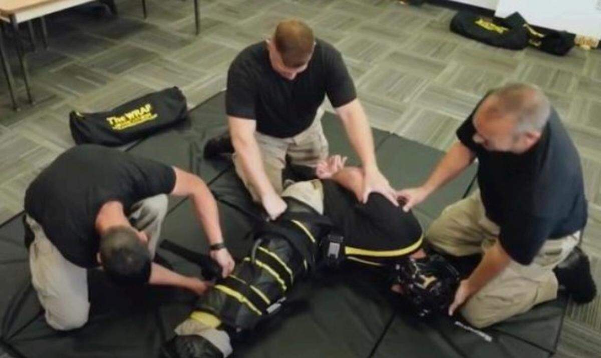 A WRAP restraint system is shown, and is similar to a full-body restraint jacket. 