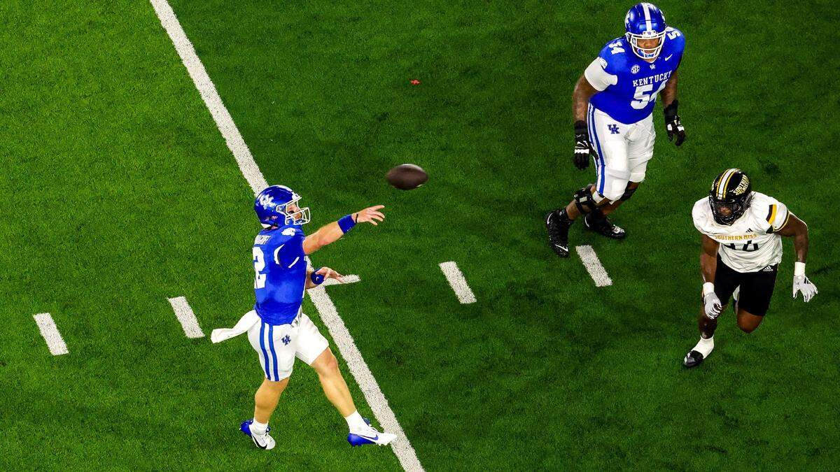 Kentucky quarterback Brock Vandagriff throws a first-quarter touchdown pass to Barion Brown during Saturday’s game against Southern Miss.