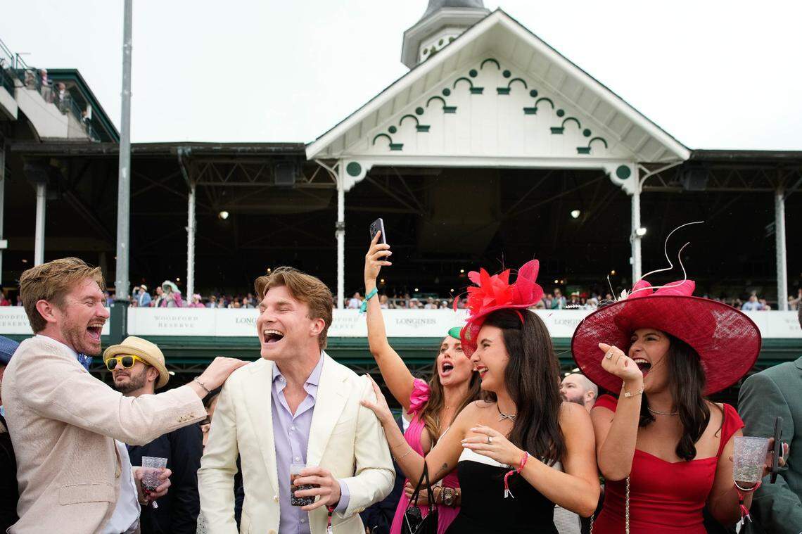 Spectators cheer during the ninth race on Kentucky Derby Day 2025 at Churchill Downs in Louisville. The 151st Kentucky Derby, scheduled for 6:57 p.m., is the 12th of 14 races Saturday.