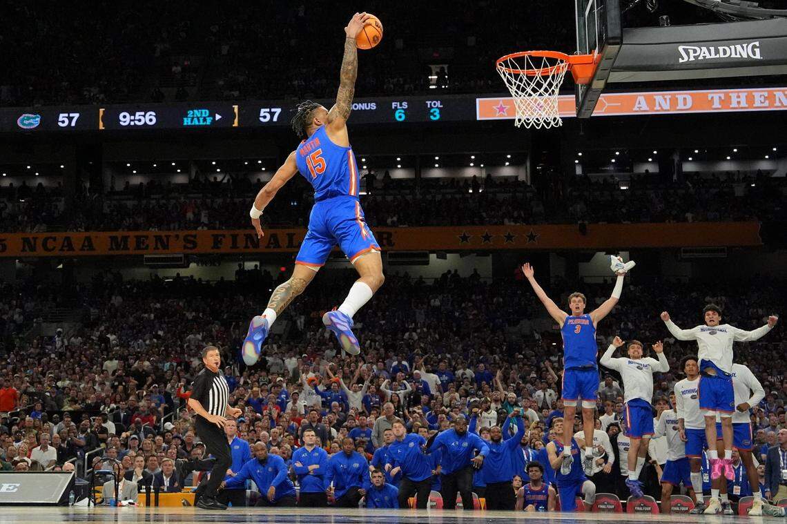 Florida guard Alijah Martin (15) dunks the ball against Auburn during the second half in the NCAA semifinals at the Alamodome in San Antonio on Saturday.