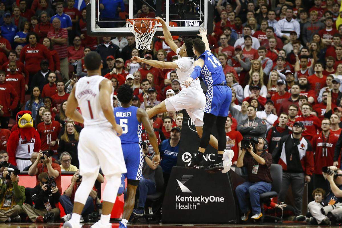 Louisville forward Jordan Nwora (33) dunked over Kentucky guard Tyler Herro (14) during UK's 71-58 victory over U of L last season at the KFC Yum Center.