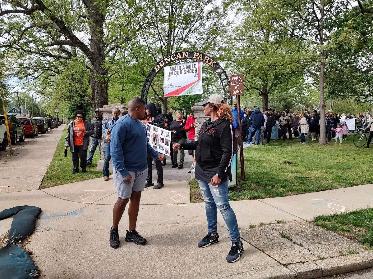Ricardo Franklin and his sister, Laneshia Conner, fist bumped before leading the Antonio Franklin Jr. Violence Intervention Project Peace Walk Saturday, April 22, 2023, at Duncan Park in Lexington, Ky. Their mother, the late Anita Franklin, started hosting peace walks soon after her son Antonio Franklin died in a 2014 shooting at the park.