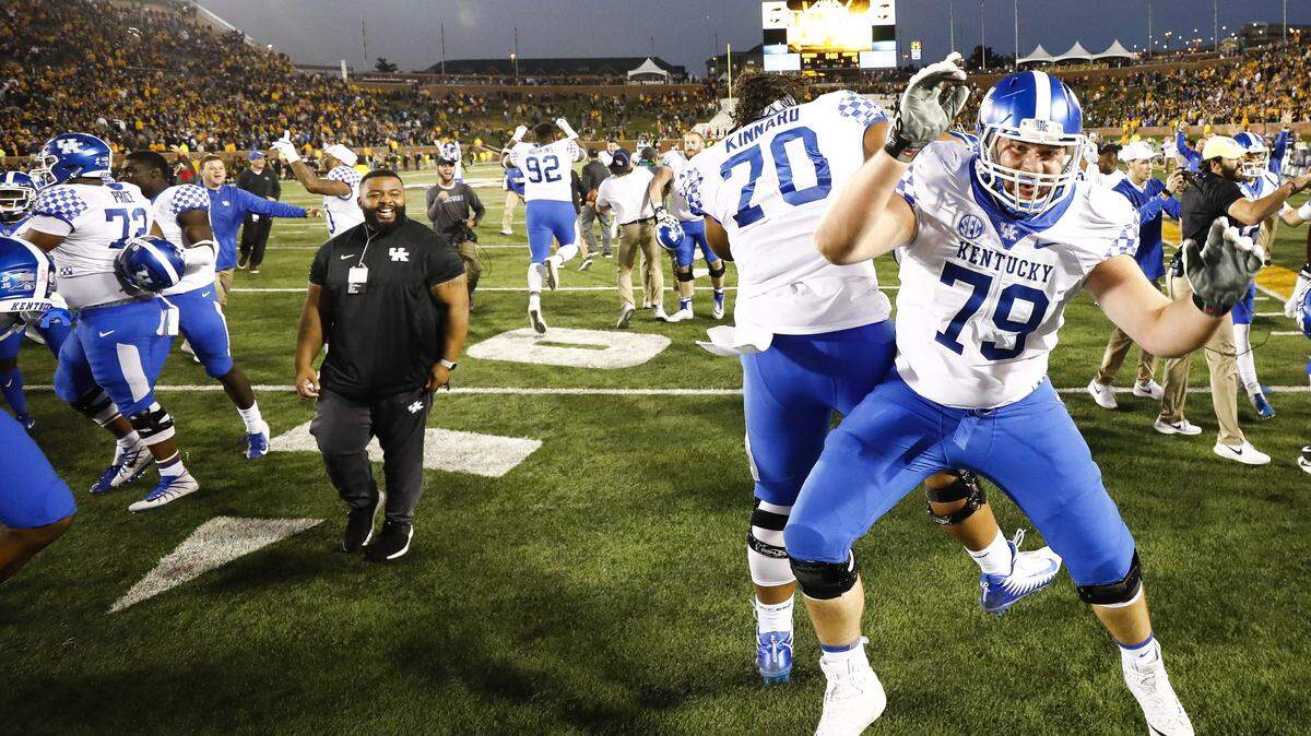 Backup Kentucky offensive linemen Luke Fortner (79) and Darian Kinnard celebrated after the Cats’ come-from-behind win at Missouri. Coaches are starting to see that second group of offensive linemen make a strong push for playing time.