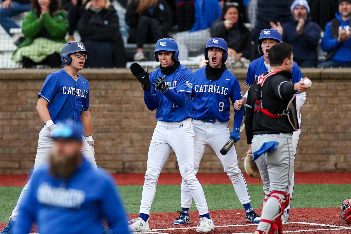 Lexington Catholic players, including Max Daugherty, center, and Tyler Nighbert (9), celebrated after teammate Brady Wasik (15) hit a three-run triple in the bottom of the sixth inning against Manual on Friday.
