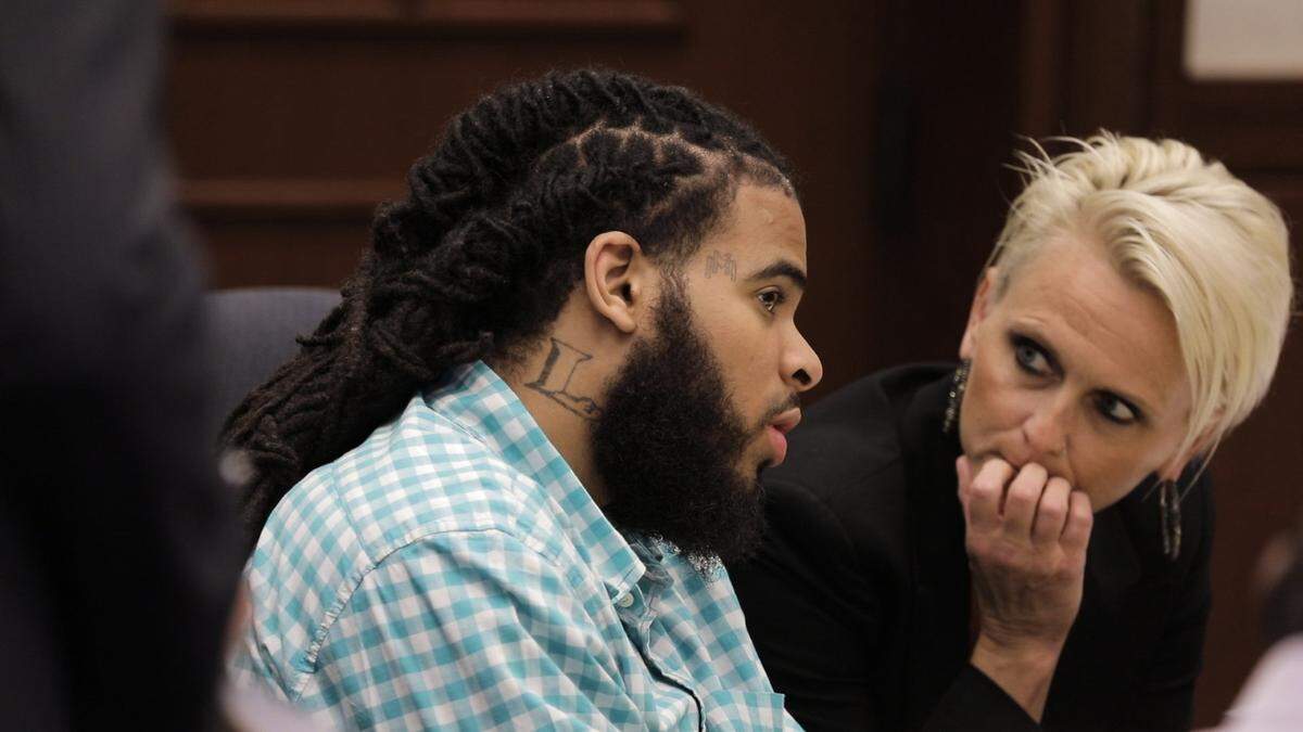 Quincinio Canada, one of two men on trial in the murder of U.S. Marine Cpl. Jonathan Price, spoke Wednesday with Karen Alexander, a mitigation specialist for his defense team.