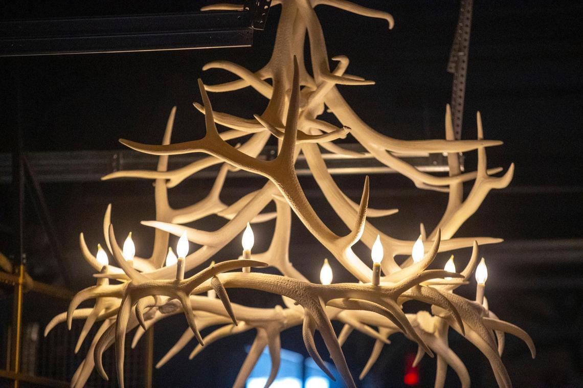 The space where District 7 Social is was part of the original barrel warehouse on the Pepper Campus and has several atmospheric touches like this antler chandelier.