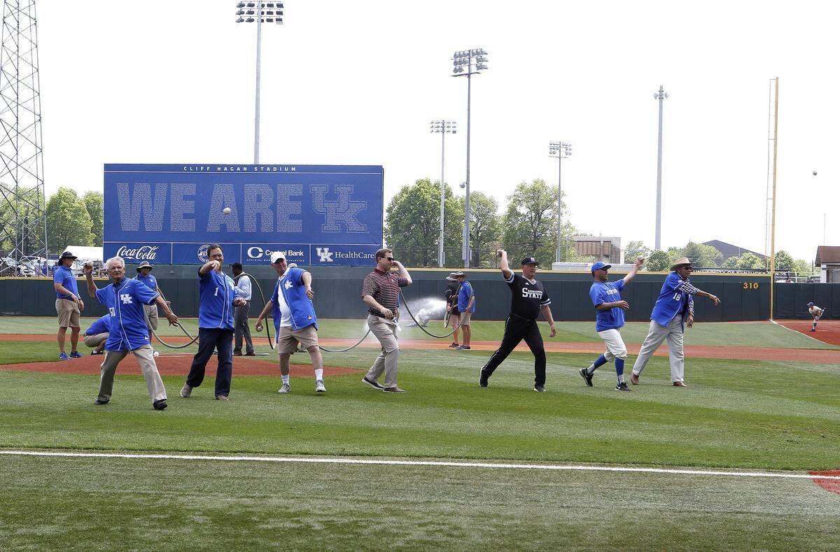 Stadium namesake Cliff Hagan, right, was joined by 5 former coaches and head coach Nick Mingione, as they threw ceremonial first pitches Sunday prior to the final regular-season game ever played at Cliff Hagan Stadium.
