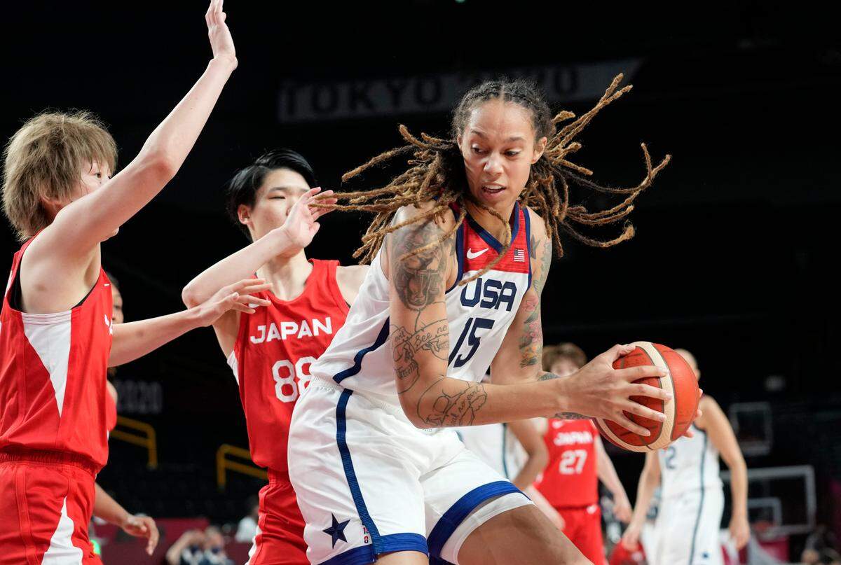 United States’ Brittney Griner (15), right, drives past Japan’s Maki Takada (8), left, and Himawari Akaho (88), center, during women’s basketball preliminary round game at the 2020 Summer Olympics, Friday, July 30, 2021, in Saitama, Japan. (AP Photo/Eric Gay)