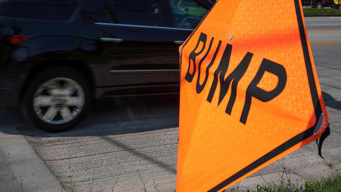 Signs for repaving work on Versailles Road between Oxford Circle to Angliana Avenue in Lexington, Ky., Monday, July 19, 2021.