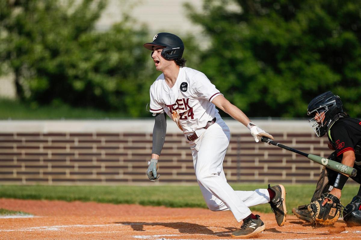 Tates Creek’s Braxton Brinegar yells after getting a hit against Paul Laurence Dunbar during Wednesday night’s game at Tates Creek.