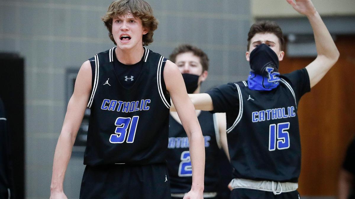 Lexington Catholic’s Hudson Sparks (31) and Griffin Cameron (15) celebrate during their game against Paul Laurence Dunbar at Paul Laurence Dunbar High School In Lexington, Ky., Thursday, Feb. 25, 2021. Lexington Catholic beat Paul Laurence Dunbar 69-67.