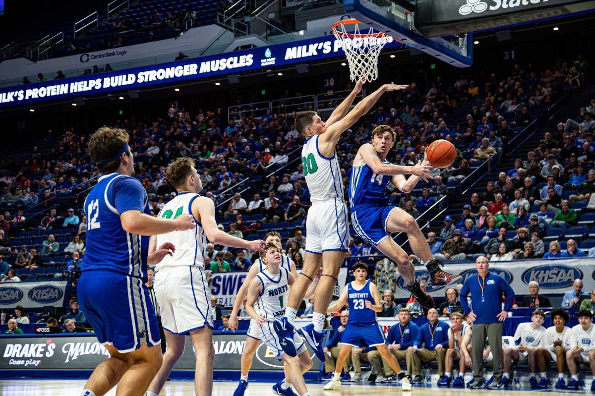 North Laurel’s Reece Davidson (30) tries to contain a drive by Breathitt County’s Austin Sperry (14) on Thursday. Sperry led the Bobcats with 22 points before fouling out.