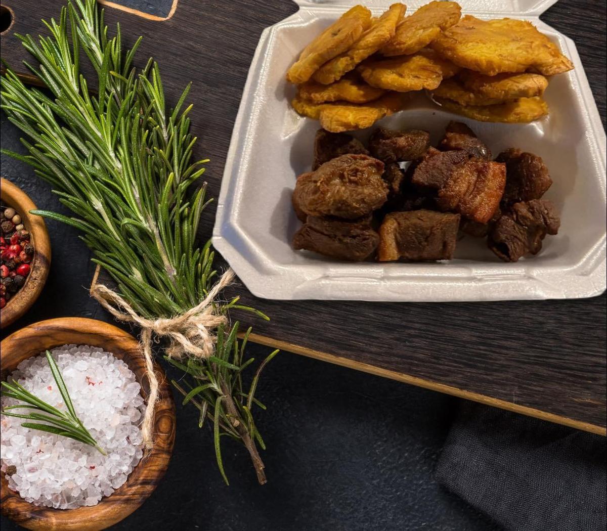 Fried pork with fried plantain from Le Gourmet, a new Haitian restaurant opening at 115 N Locust Hill Dr., next to Cuban dining spots, Hola Havana.