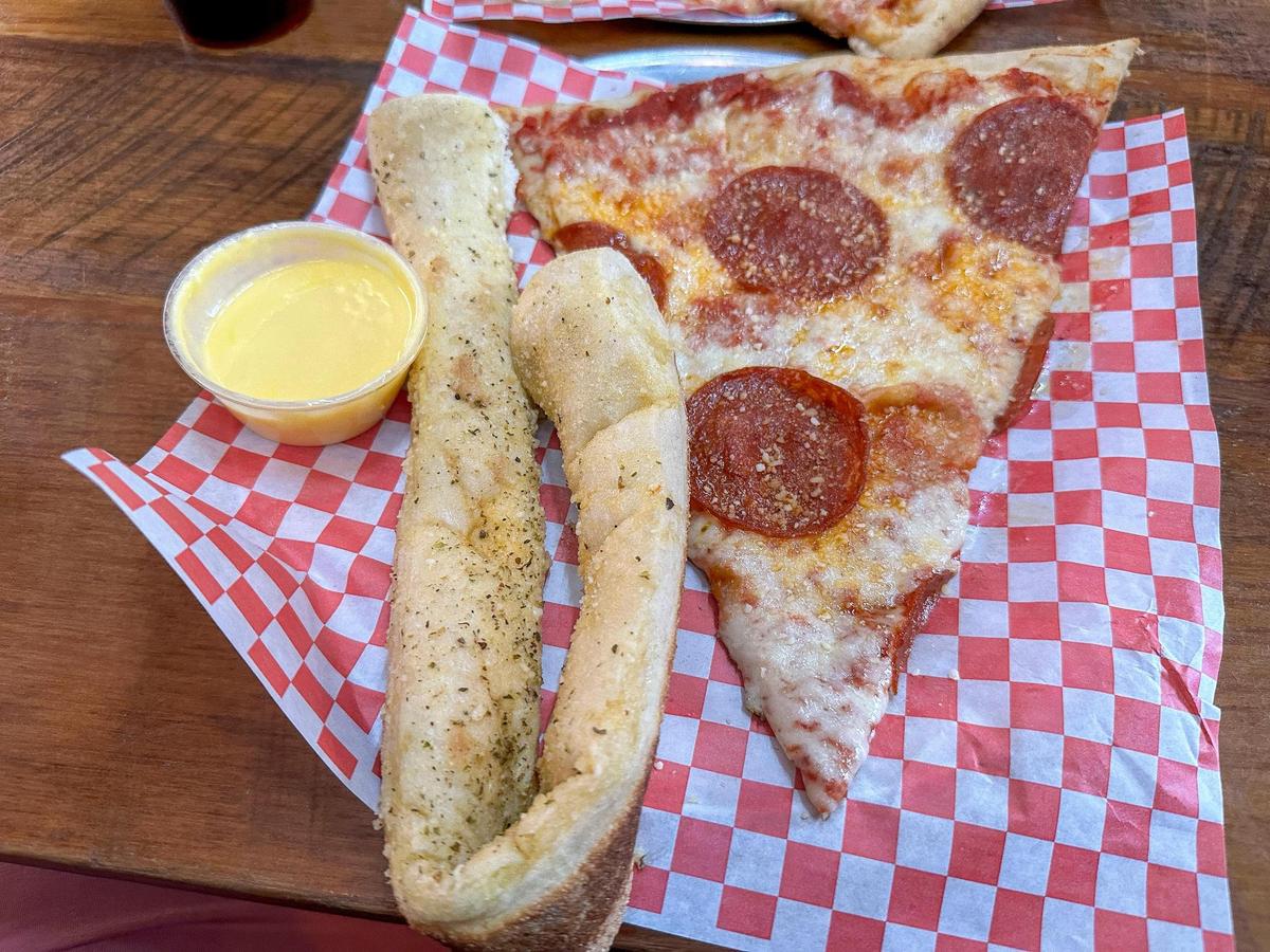 A slice of pepperoni pizza and a breadstick from Goodfellas Pizzeria. The local pizzeria has two Lexington locations, one downtown and one in the Distillery District.