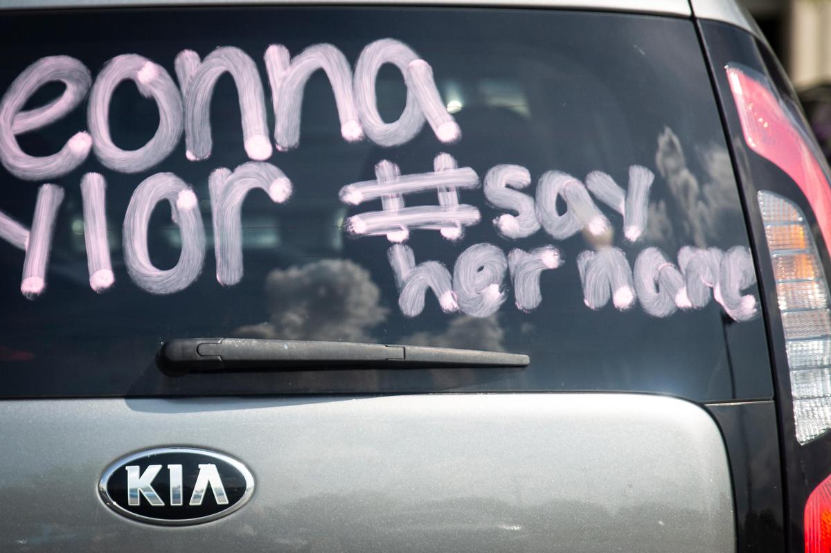A car has writing on it in preparation for the car caravan protest held in honor of Breonna Taylor in Lexington, Ky., on Friday, June 5, 2020.