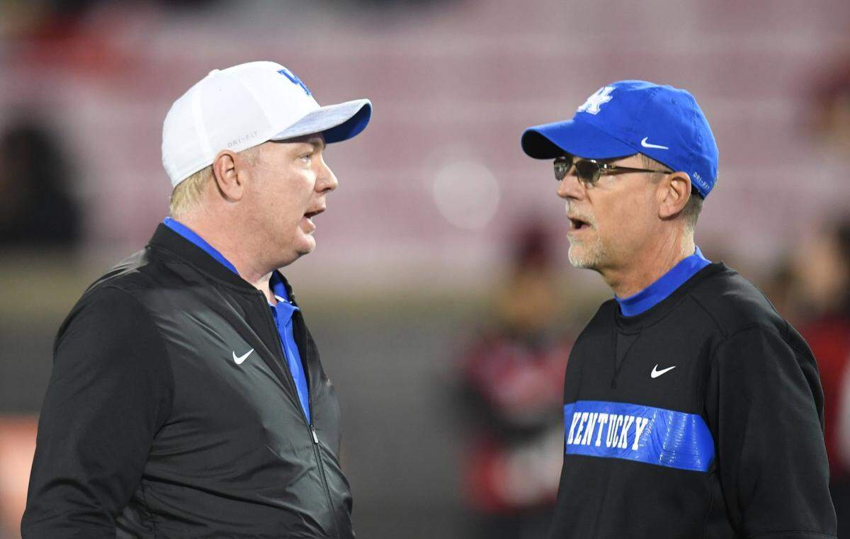UK Coach Mark Stoops, left, went 37-26 with offensive coordinator Eddie Gran calling the plays for the Wildcats from 2016-20. After last season, Stoops parted ways with Gran in search of a more balanced offensive approach.