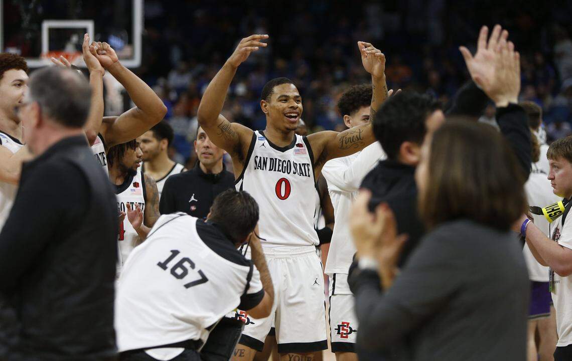 Keshad Johnson (0) celebrates after San Diego State’s win against Furman in the second round of the NCAA Tournament.