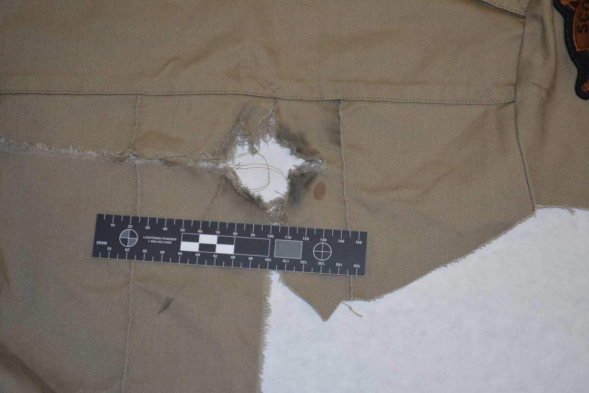 A photograph of Deputy Jaime Morales’ uniform shirt from the night in 2018 in which he was shot allegedly by another officer. The photo was included in a lawsuit filed by Morales against Georgetown and some city and police officials. A forensic reconstructionist’s report says the shirt shows he was shot in the back from a distance of between 4 and 8 inches. The soot surrounding the hole is predominantly on the right side, indicating the muzzle of the firearm that shot the bullet was at an angle to the shirt’s surface.