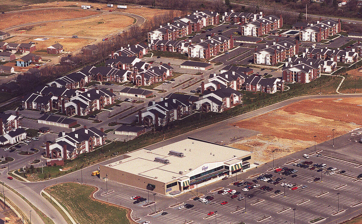 Aerial photo looking at the new Kroger and apartments in the Beaumont Farm development of Harrodsburg Road at New Circle Road in Lexington, March 6, 2000. The 63,000-square-foot Kroger anchored the new shopping center, which covered a total of 250,000 square feet on more than 30 acres of land. Neighbors in the Harrods Hill subdivision originally objected to the plan, which had called for an unnamed 123,000-square-foot store next to Kroger. After meeting with neighbors, the size of the store was reduced to 50,000 square feet. Years later the Kroger expanded to what it is now, a 125,000-square-foot MarketPlace store.