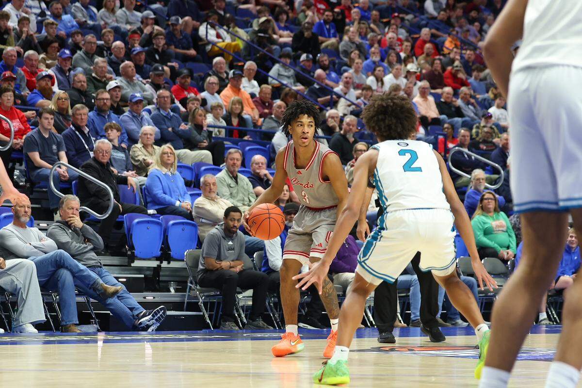 George Rogers Clark’s Malachi Ashford squares up against North Oldham’s Pierre Rondo (2) during the UK HealthCare Boys’ Basketball Sweet 16 state tournament semifinals at Rupp Arena on Saturday.