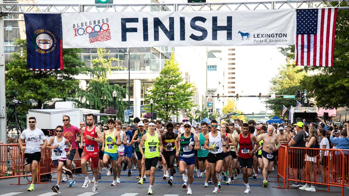 Runners take off from the starting line during the 2025 Bluegrass 10,000 in downtown Lexington on Friday morning.