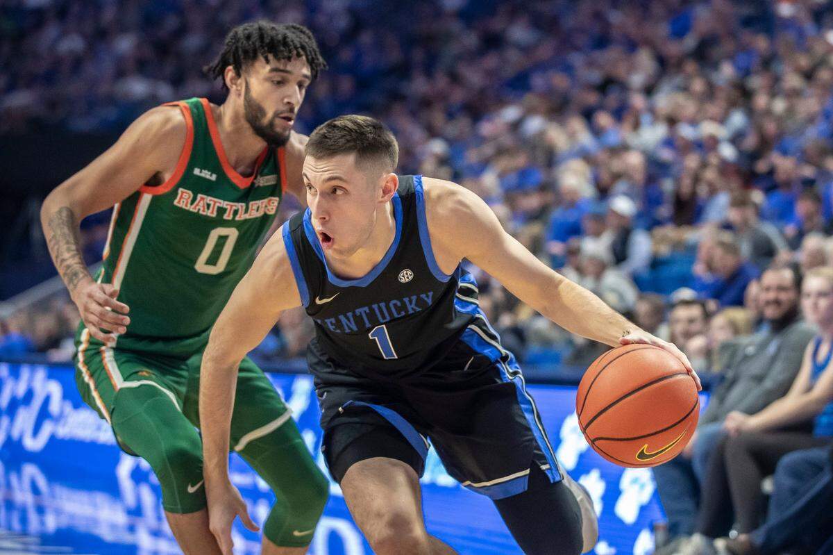 Kentucky guard CJ Fredrick (1) drives the ball past Florida A&M guard Dimingus Stevens (0) during Wednesday’s game at Rupp Arena.