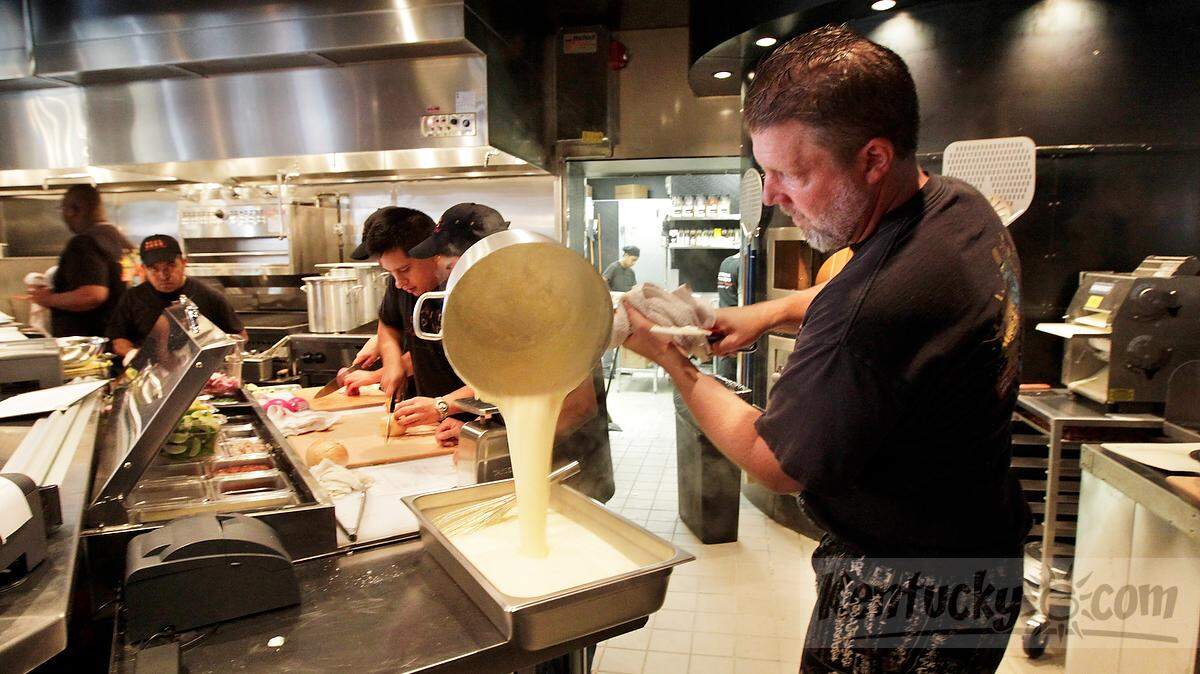 Chef Jeffery Mayer prepared a mornay sauce for hot Brown pizzas Tuesday while training staff at Saul Good on Broadway and Short Street. The restaurant will open on Monday.