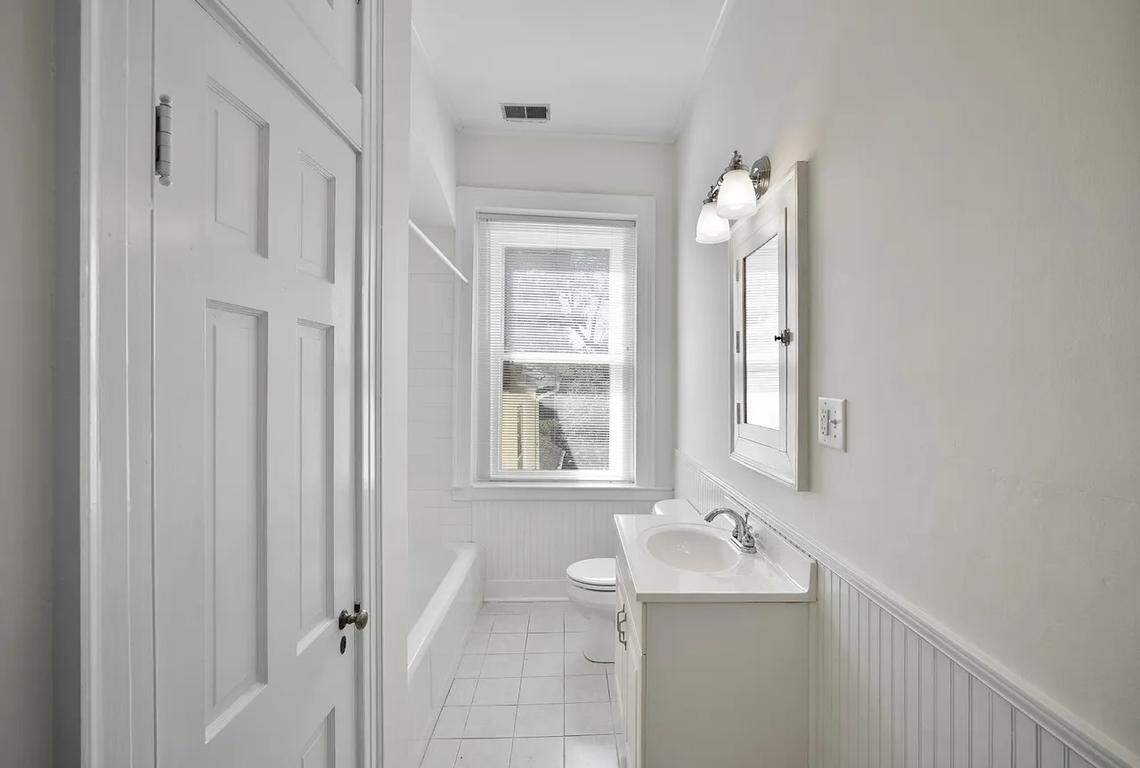 A view of the bathroom that adjoins an upstairs primary bedroom at 315 Heritage Road in Woodford County.