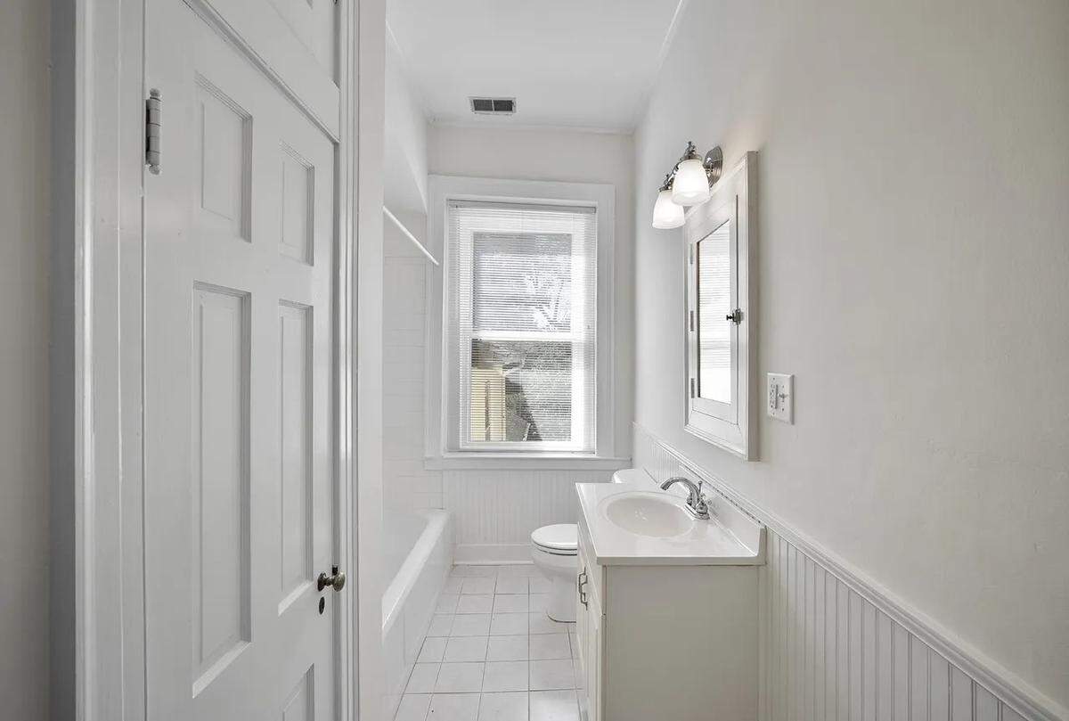 A view of the bathroom that adjoins an upstairs primary bedroom at 315 Heritage Road in Woodford County.