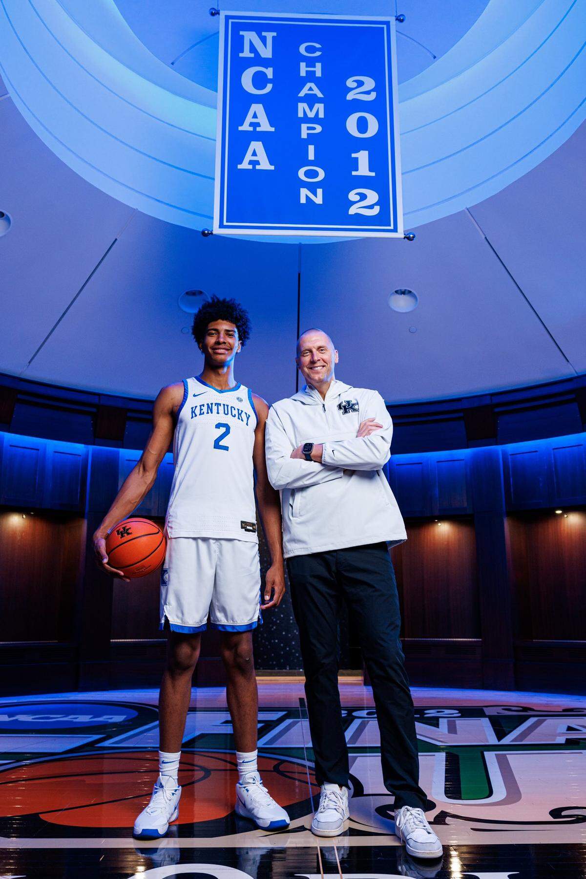 Class of 2025 college basketball recruit Chris Cenac, left, poses for a photo with Kentucky men’s basketball coach Mark Pope, right, while Cenac was on a recruiting visit to UK in September.