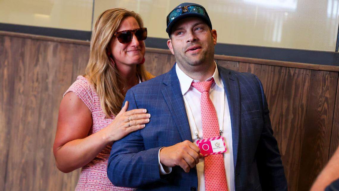 Trainer Brad Cox, right, celebrated with his wife, Livia Frazar, after his horse, Good Cheer, won the 2025 Kentucky Oaks at Churchill Downs.