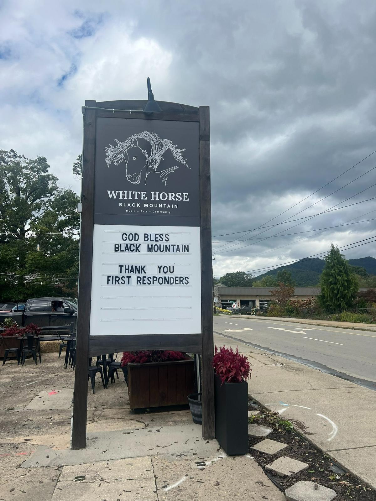 White Horse Black Mountain, a music venue in Black Mountain, North Carolina, displays a sign after Hurricane Helene hit the area. Herald-Leader reporter Monica Kast, along with two friends, were stranded in the town over the weekend.