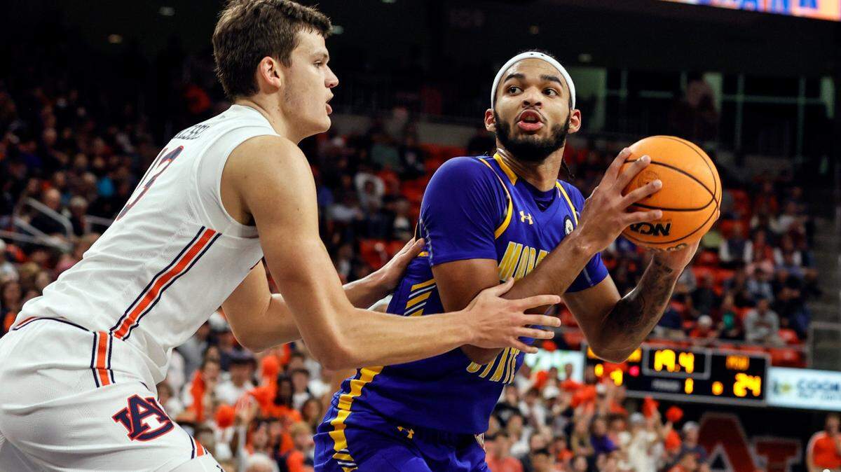Morehead State forward Johni Broome (4) looks for shot as Auburn forward Walker Kessler (13) defends during the first half of an NCAA college basketball game Tuesday, Nov. 9, 2021, in Auburn, Ala. (AP Photo/Butch Dill)