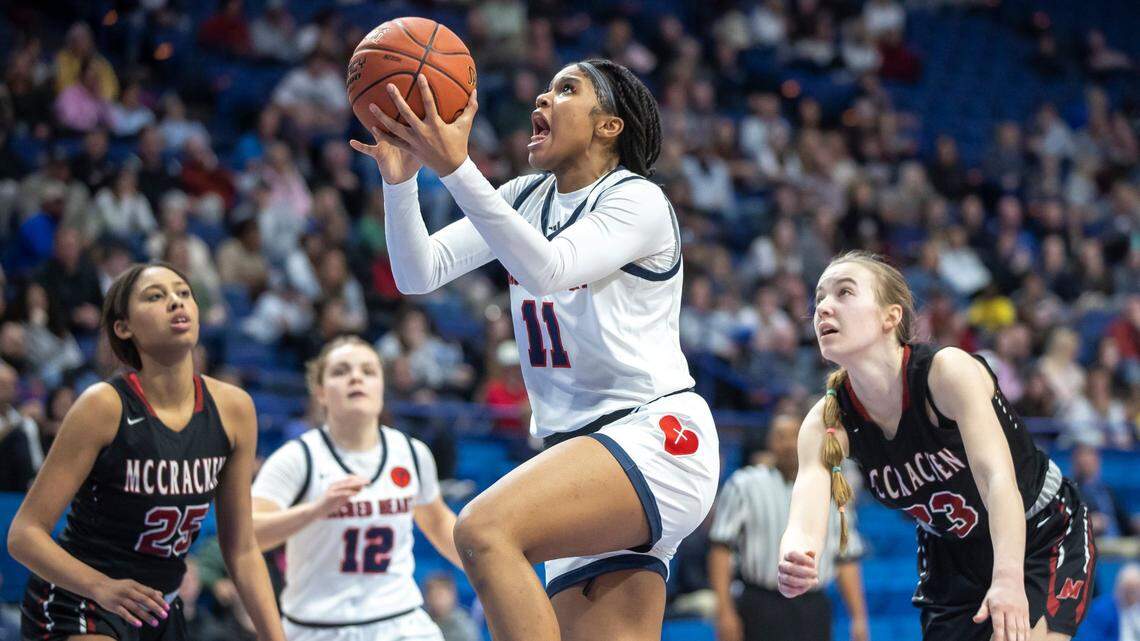 ZaKiyah Johnson (11) has helped lead Sacred Heart to back-to-back state championships. Even though she was named MVP of the Sweet Sixteen both times, Johnson has always enjoyed putting the team first. “She doesn’t have to be the big leading scorer and score 40, 30 points,” Valkyries Coach Donna Moir said. “It’s not all about her.”