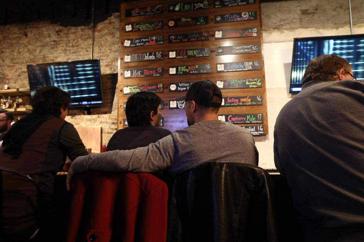 Patrons sat at the bar Friday night at My Old Kentucky Foam Brewing Co. on Main St. in Georgetown. Photo by Matt Goins