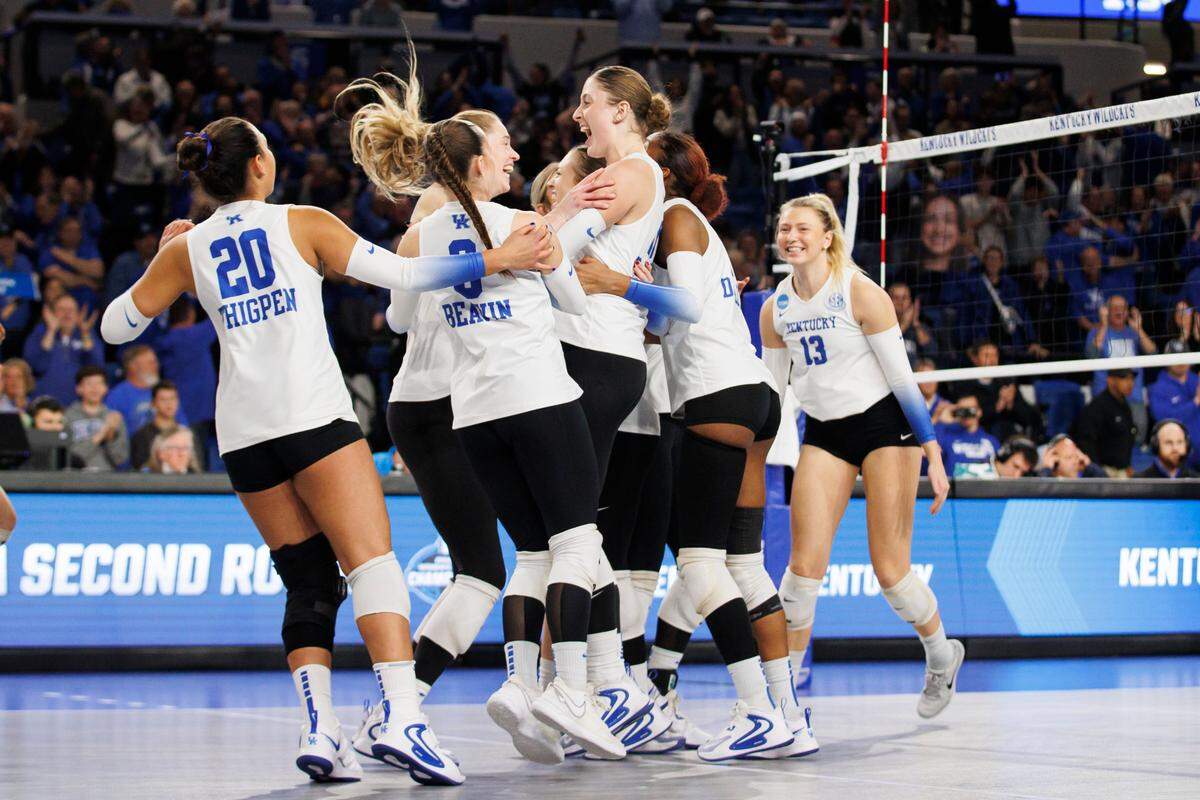 Kentucky volleyball celebrates its 3-1 win over Minnesota in the second round of the NCAA Volleyball Tournament on Friday night in Memorial Coliseum.