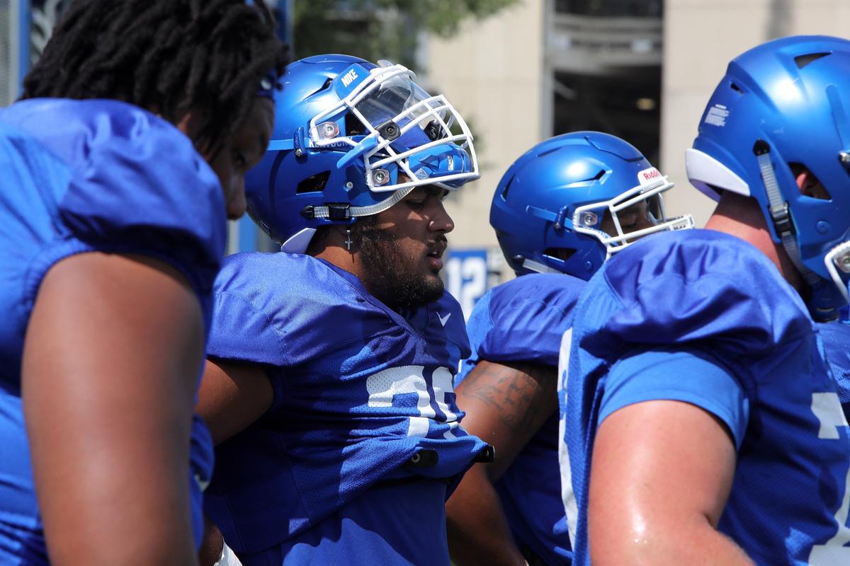 True freshman Darian Kinnard, center, has been working mostly with the offensive guards this preseason, but likely will move out to provide depth at the tackle spots this season.