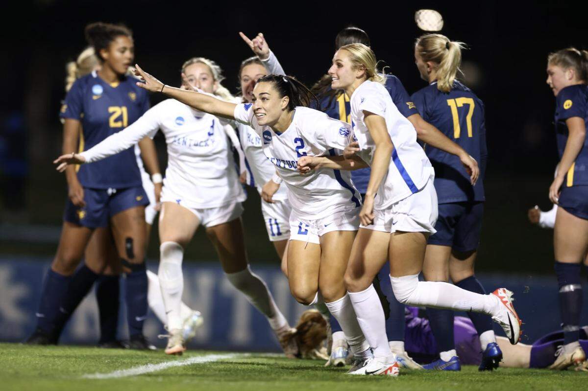 Kentucky’s Maddie Kemp (2) celebrates scoring against West Virginia in the first round of the NCAA Tournament on Friday at the Wendell and Vickie Bell Soccer Complex in Lexington.