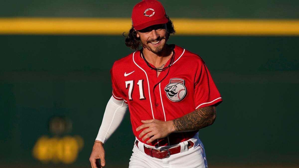 Cincinnati’s Jonathan India warms up prior to a spring training game. The rookie is projected to start at second base for the Reds this season.