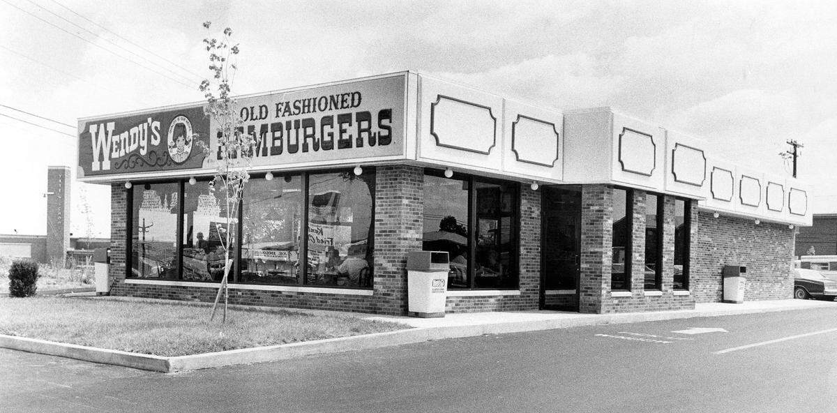 A Wendy’s fast food restaurant in July 1978, shortly after opening at 757 East New Circle Rd. in Lexington. It was the city’s third location for the old fashion hamburger chain that was founded in 1969 in Columbus, Ohio by Dave Thomas. The other two Lexington locations were at 1499 Boardwalk Dr., just off New Circle Rd. and 2575 Nicholasville Rd. On the left side, in the background of the photo is Yates Elementary School. In October the location will become the site of a Tudor’s Biscuit World.