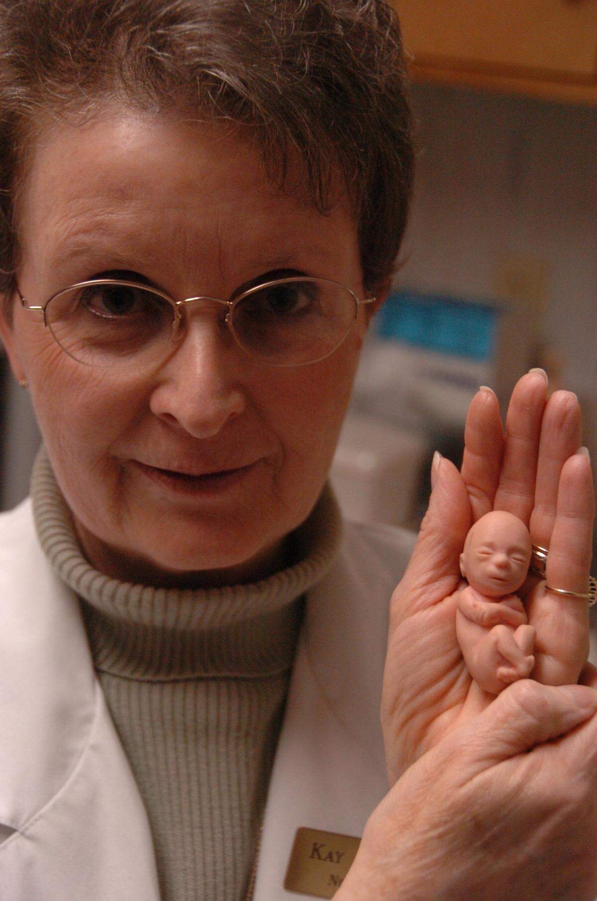 Nurse Kay Frost holds a plastic model of what a 12-week old fetus looks like at the AA Pregnancy Help Center on Jan. 26, 2006 in Lexington, Ky. The center encourages women not to have abortions.