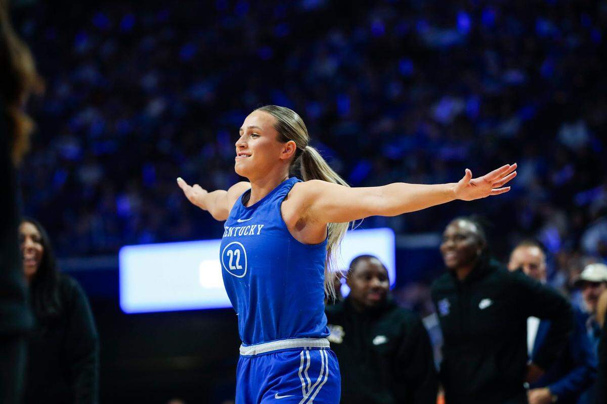 Maddie Scherr, Kentucky’s returning leader in points, rebounds and assists from last season, flexes after winning the three-point shooting contest during Big Blue Madness in Rupp Arena on Friday night.