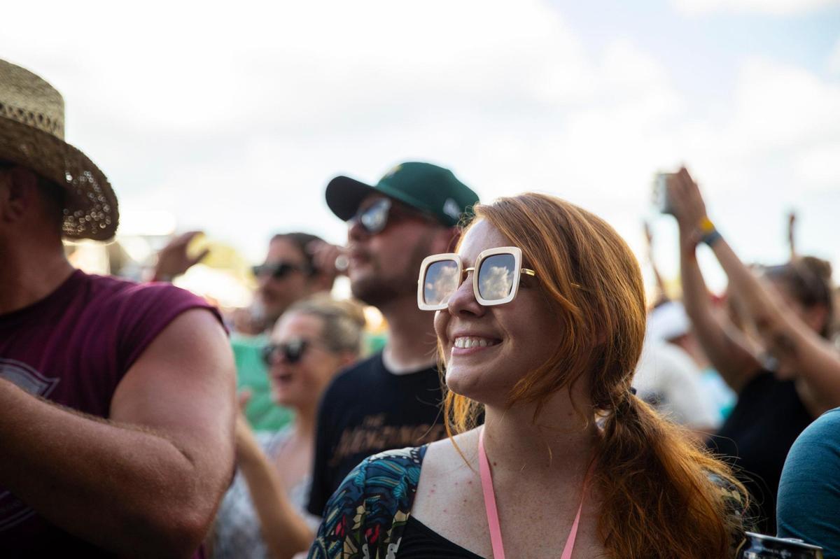 Festival goers listen as Margo Price performs at the Railbird Festival at Keeneland in Lexington, Ky., on Saturday, Aug. 28, 2021.